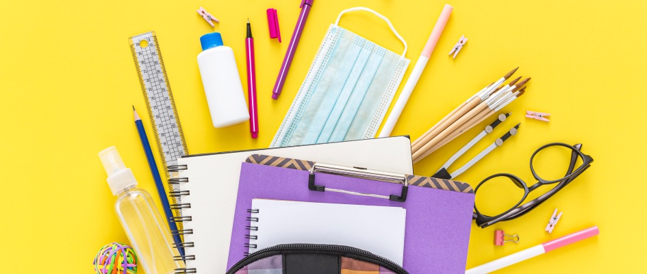 flat-lay-back-school-materials-with-book-bag-glasses